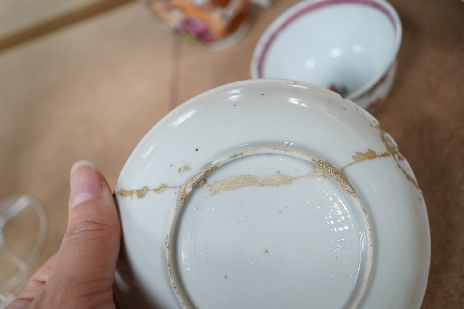 A Chinese porcelain famille rose 'double pheasant' tea bowl and saucer and a Mandarin pattern coffee cup and saucer, all Qianlong period, largest 11.5cm diameter. Condition - one saucer broken, others fair to good